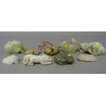 A group of nine Chinese jade carvings of animals and a bird, various forms and colours,