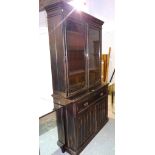 A 20th century black painted bookcase cabinet with secretaire drawer over cupboard,