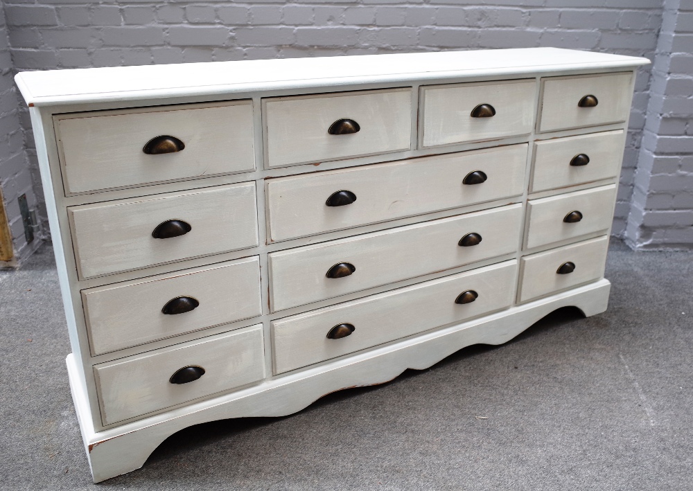 A 20th century off-white painted pine chest of thirteen various drawers, on shaped plinth, - Image 4 of 4