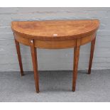 A George III mahogany banded satinwood semi-elliptic card table, on tapering square supports,