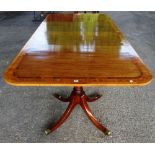 A rosewood banded mahogany twin pedestal extended dining table, incorporating George III timber,