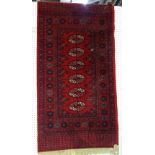A Khotan rug, 265 x 164cm and a machine made Bokhara rug, 175 x 90cm.