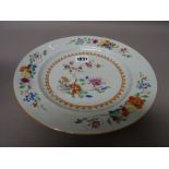 A Chinese famille-rose export plate, Qianlong, painted with flowers and fruit, 26cm.