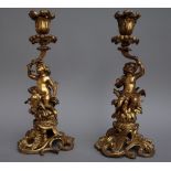 A pair of late 19th century gilt bronze figural candlesticks,