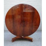 A William IV rosewood centre table, the circular snap top on octagonal column and three scroll feet,