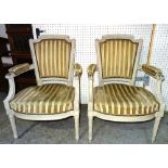 A pair of Louis XVI style grey painted open armchairs on fluted supports, 61cm wide x 89cm high (2).