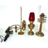 A quantity of assorted Victorian oil lamps and various glass shades.