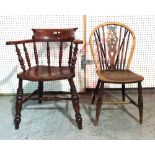 An early 20th century elm Captain's open armchair with bobbin turned supports and a wheelback