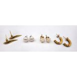 A pair of gold and seed pearl cluster earstuds, a pair of 18ct gold earstuds, each of tapering form,