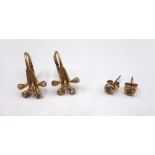 A pair of gold and diamond single stone earstuds,