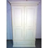 A 20th century cream painted double wardrobe with two panelled doors over single drawer,