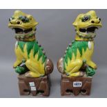 A pair of Chinese sancai glazed Buddhist lions, late 19th/20th century,