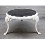 A late 19th century white painted circular cast iron plant stand on three scroll supports,