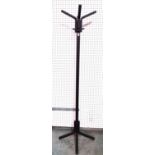 A 20th century ebonised four tier coat rack, 185cm high.