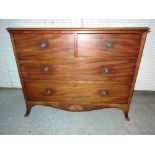 A early 19th century mahogany chest of two short and two long drawers on splayed bracket feet,