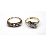 A gold and platinum, diamond set three stone ring,