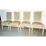 A set of four Regency style white painted dining chairs on fluted tapering supports, (4).