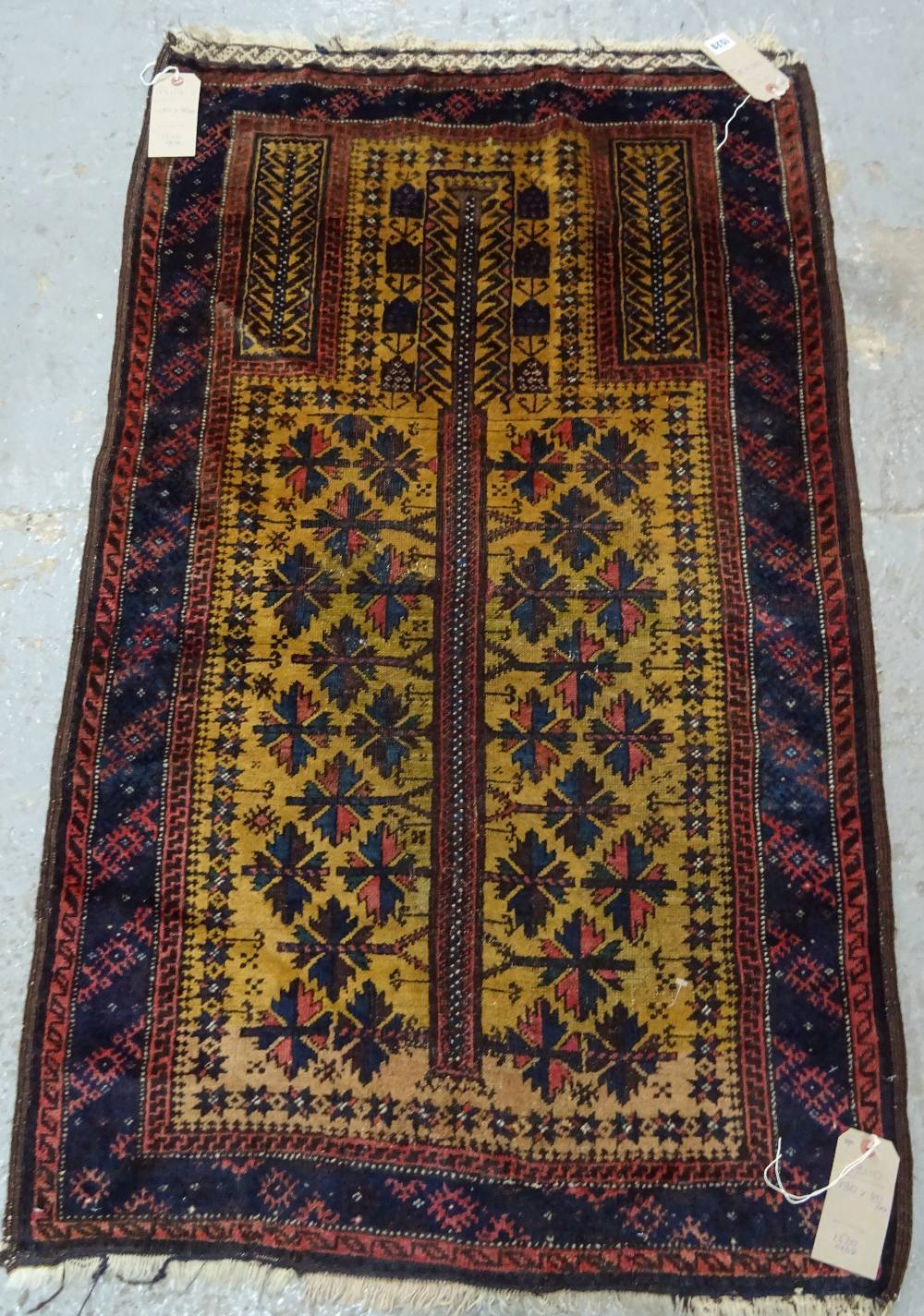 A Beluchistan prayer rug, the saffron mehrab with a flowering tree of life, plant spandrels, - Image 3 of 7