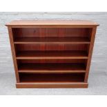 A Victorian mahogany floor standing open bookcase on a plinth base,