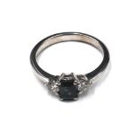 An 18ct white gold, sapphire and diamond three stone ring,