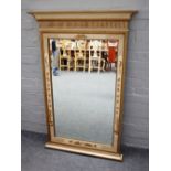 A cream lacquer parcel gilt decorated rectangular mirror,