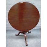 A mid-18th century mahogany occasional table, the circular snap top on tripod base,