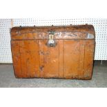 An early 20th century metal dome top trunk with faux wood decoration, 65cm wide x 48cm high.