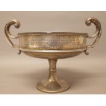 A silver twin handled trophy bowl, presentation inscribed, raised on a circular foot, Chester 1910,