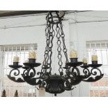 A pair of English wrought iron eight light chandeliers, late 20th century,