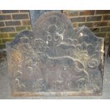 An 18th century cast iron arch top fire back depicting an heraldic lion, 75cm wide x 70cm high.
