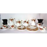 A Royal Albert Old Country Roses pattern part dinner service and a pair of Wedgwood urns, black,
