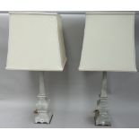 A pair of modern grey hardstone and brass table lamps, of tapering square sectional form,