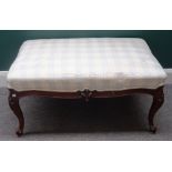 A 19th century French walnut framed rectangular footstool, on four scroll supports,
