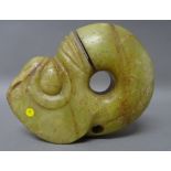 A Chinese Hongshan style jade pig-dragon (zhulong), the stone of yellowish tone, 15cm. length.