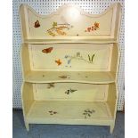 A 20th century cream painted waterfall bookcase decorated with butterflies and dragonflies,