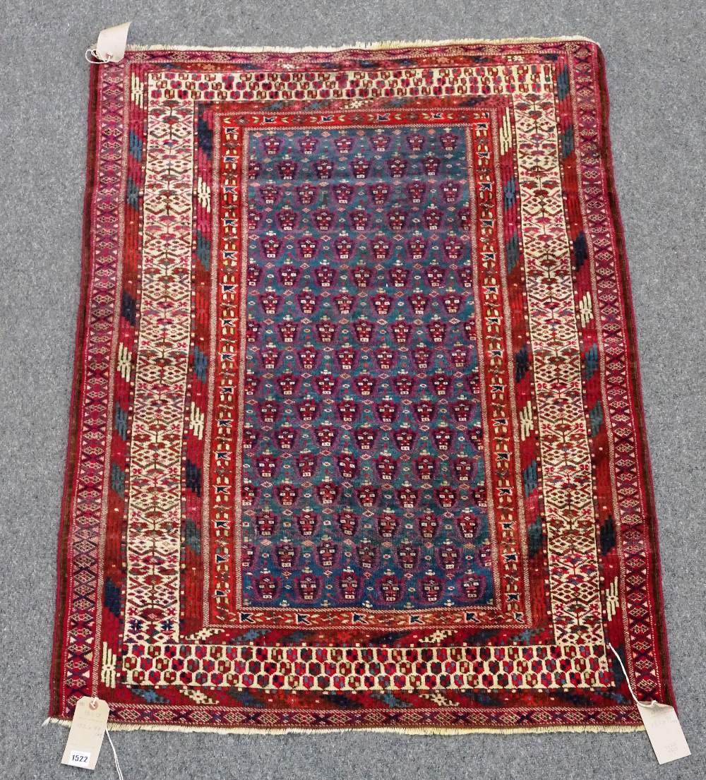 An unusual Yomut rug, Turkman, the indigo field with an allover boteh design,
