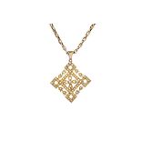 A gold and seed pearl set pendant, circa 1910, in a pierced openwork design, detailed 15 CT,