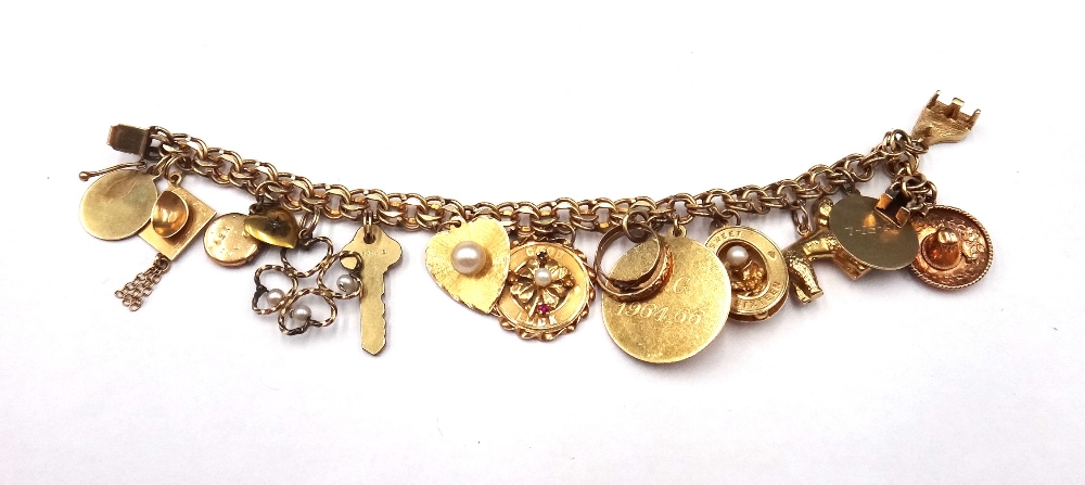 A gold multiple link bracelet, on a snap clasp, detailed 14 K,