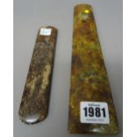 A Chinese jade axe blade or chisel, the stone of celadon, russet and cream tone, 24.5cm.