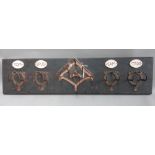 A wall mounted horse tack rack, by Martin Scorey, painted wood and metal,