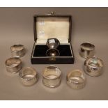 Silver, comprising; a pair of napkin rings, initial engraved by Mappin & Webb, London 1954,