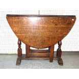 An 18th century oak drop flap table, 92cm wide x 72cm high.