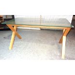 A 20th century rectangular frosted glass dining table on hardwood 'X' frame base,