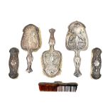 A silver mounted Art Nouveau composite six piece lady's dressing set,