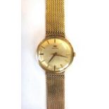 A Marvin 9ct gold circular cased gentleman's bracelet wristwatch, the signed circular dial,
