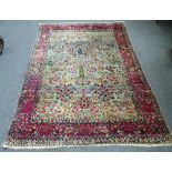 A Kerman garden carpet, Persian, the pale indigo field with a central cypress tress,