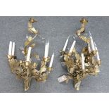 A pair of modern nine branch gilt metal wall lights, each cast as an arrangement of flowers,