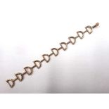 A 9ct gold bracelet, in a 'D' and bar link concertina design, with a hook shaped clasp,