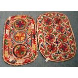 An Uzbek felt saddle cloth, the ivory field with two column of four cross roundels,