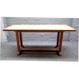 In the manner of Gordon Russell, a mid-20th century oak refectory table, on four block supports,